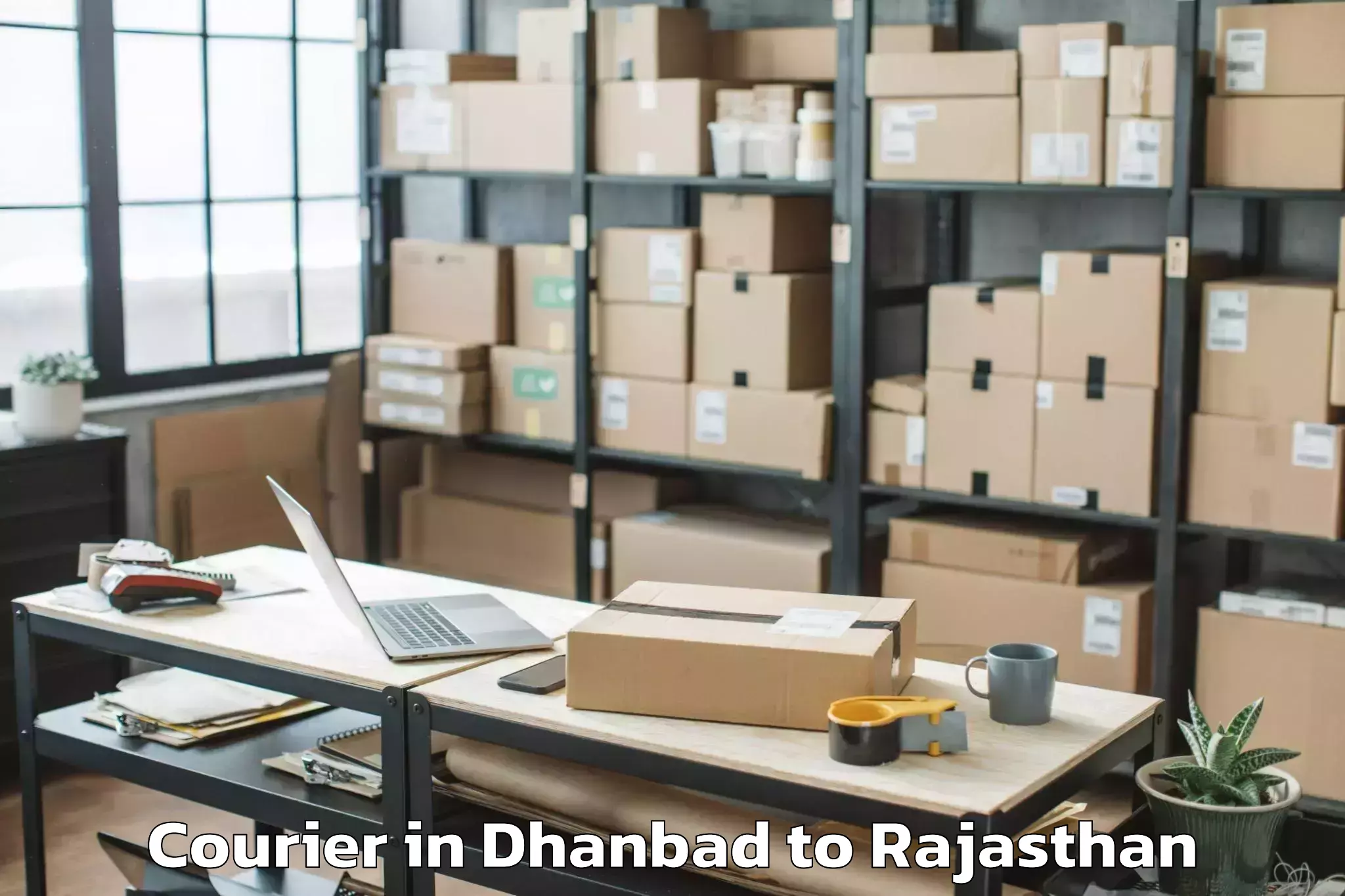 Easy Dhanbad to Madanganj Kishangarh Courier Booking